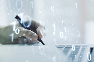 Wall Mural - creative abstract binary code sketch and hand writing in notepad on background with laptop, hacking 