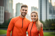 © BrightSpace - couple in the park and city , orange exercise clothes, lifestyle people