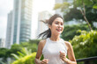 © BrightSpace - Vibrant Midlife Woman Exercising Outdoors: Beautiful Lady portrait people jogging with Freshness in Urban Park with Trees and Buildings with bright sun and nature light, healthy concept, gen ai