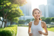 © BrightSpace - Vibrant Midlife Woman Exercising Outdoors: Beautiful Lady portrait people jogging with Freshness in Urban Park with Trees and Buildings with bright sun and nature light, healthy concept, gen ai