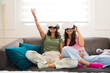 Happy teenagers having fun with virtual reality technology