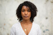 © mimagephotos - Close up young woman with serious expression