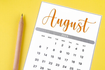 The August 2023 Monthly calendar for 2023 year with pencil on yellow background.