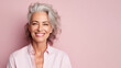 © ShniDesign - Smiling attractive woman 50s years old look to the camera, isolated on plain pink background studio portrait. People lifestyle concept. AI Generated.