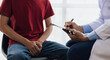 © Wasan - A man suffering from sexual dysfunction visits a doctor for treatment. Male health problem concept.