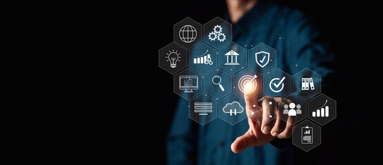 Businessman or Analyst working with Business Analytics and Data Management System on virtual screen,Corporate strategy for finance, operations, sales, marketing.