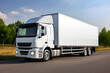 © vladdeep - White Truck transportation on the intercity road. Mock up logistic vehicle. Generative AI