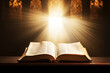 Leinwandbild Motiv Open Holy bible book with glowing lights in church