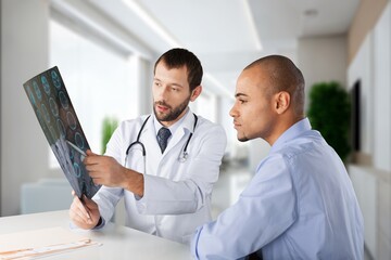 Wall Mural - Young doctor and patient health planning in hospital