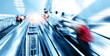 © xy - People rush on escalator motion blurred