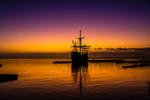 Spanish Galleon Docked At The Pier Before Sunrise