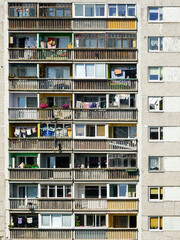 Wall Mural - A fragment of the facade of an old apartment building in a poor area, cheap city quarter