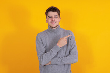 Sticker - isolated young man or teenager pointing smiling