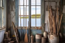 Oars Framed By A Weathered Window In A Coastal Shack, Created With Generative Ai