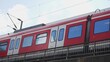 SPNV-Nord passenger rail transport train at Koln, Cologne Hbf (Hauptbahnhof) central train station. Red DB (Deutsche Bahn) train, slow motion