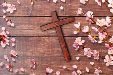 Wall Mural - Wooden Christian cross with fresh flowers