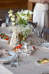 Poster - Beautiful wedding table decorations. Tablewear and bouquet of flowers.