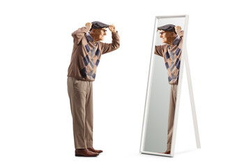 Poster - Full length profile shot of a elderly gentleman putting on a hat in front of a mirror