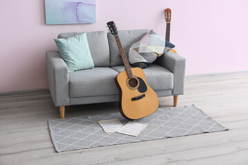 Poster - Interior of room with sofa and guitars