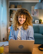 © Miljan Živković - one woman adult caucasian work on her laptop at home happy smile