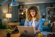 © Miljan Živković - one woman adult caucasian work on her laptop at home happy smile
