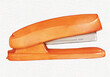 Stapler isolated on white background. hand drawn Watercolor Orange office stapler for stapling paper. Stapling equipment for work or education