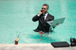 © be free - photo of business manager wearing suit work in summer pool, banner. business manager work