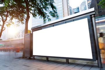 Wall Mural - Blank advertisement billboard in a bus stop, with blurred bus