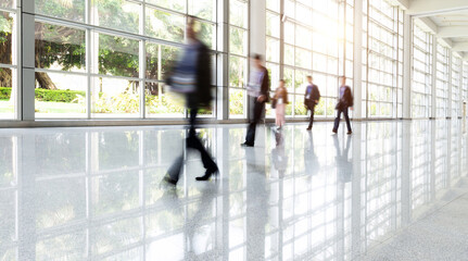 Wall Mural - Group of business people walking in glass building