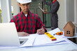 © weerachai - Team Engineer and Architect planing and discuss at Construction Site with blueprint
