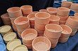 Orange terracotta coffee cups mixed together