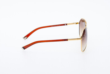 Wall Mural - Fashion sunglasses red and gold frames on white background.