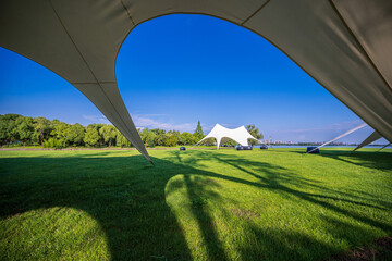 Wall Mural - Tents for camping on the lawn on a sunny day, travel theme.