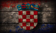 Abstract vintage croatian flag and crest on weathered wood boards