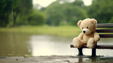 Teddy Bear Toy Sitting On The Wooden Bench In The Rain