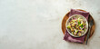 © fascinadora - Waldorf salad banner, copy space. American fruit and nut salad with apples, celery, grapes, chicken meat, dressed mayonnaise. Craft plate with ready-to-eat waldorf salad on light background. Top view