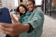 © ReeldealHD images - Young adult couple taking a selfie on a city break