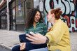 © ReeldealHD images - Two friends laughing at a selfie on a city break
