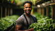 © AS Photo Family - Young african american man working in a greenhouse, holding a bunch of lettuce. Generative AI.