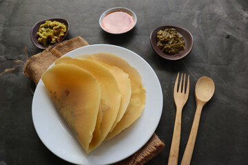 dosa masala. Paper Masala dosa is a South Indian meal served with sambar and coconut chutney over fresh banana leaf.