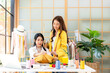 © freebird7977 - Two Young women fashion designer using laptop working and received order customer for design tailor and cloth in the showroom,  Lifestyle Stylish tailor taking