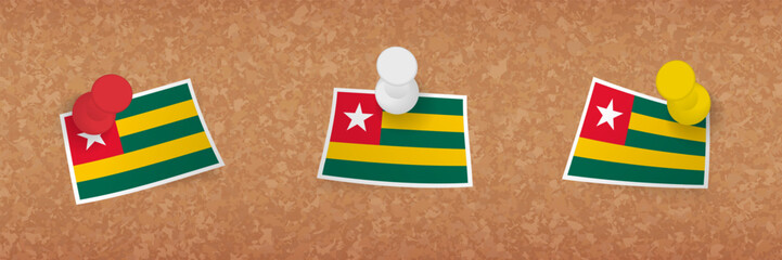 Wall Mural - Togo flag pinned in cork board, three versions of Togo flag.