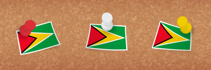 Sticker - Guyana flag pinned in cork board, three versions of Guyana flag.