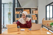 © Natee Meepian - Beautiful Muslim woman selling online at home, business owner, business sme concepts