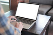© panitan - computer screen blank mockup.hand woman work using laptop with white background for advertising,contact business search information on desk at coffee shop.marketing and creative design