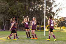 Happy Kids On Football Team Near Goal Post