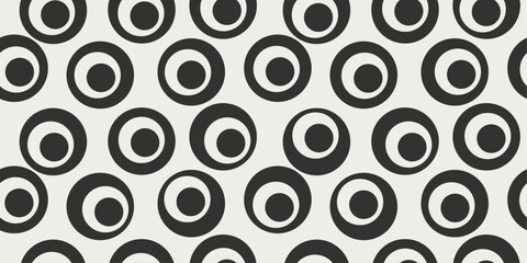 Leinwandbilder - Circles with other circles inside. A vector simple pattern that consists of black circles with white circles inside.
