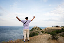 Back View Of Man Standing On Top Of A Mountain And Looking At The Sea. Cape Emine, Black Sea Coast, Bulgaria.