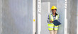 © NVB Stocker - Portrait Asian indian female professional Engineer factory. Engineering worker in safety hardhat at factory industrial facilities. Heavy Industry Manufacturing Factory. Prefabricated concrete walls