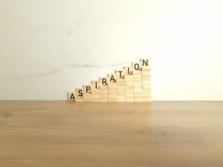 Word aspiration made from wooden blocks